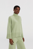 Maglione a maglia di dolcevita verde chiaro di grandi dimensioni